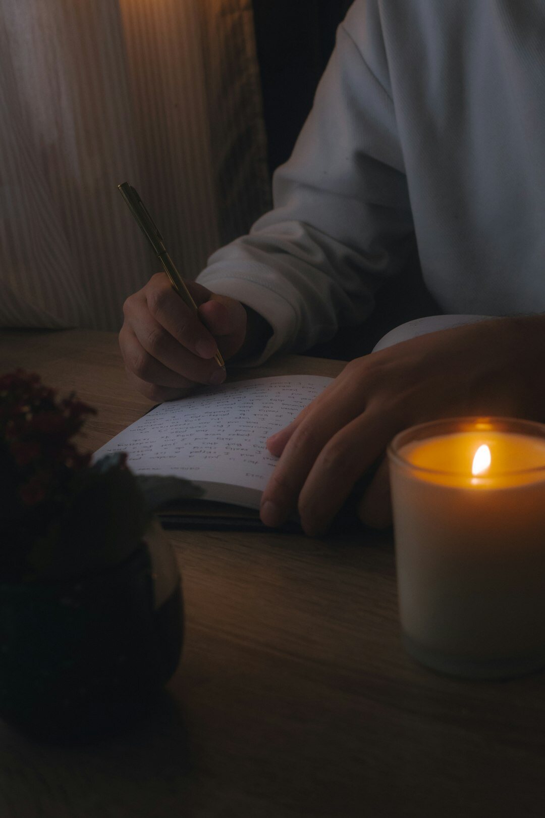 person journaling in notebook