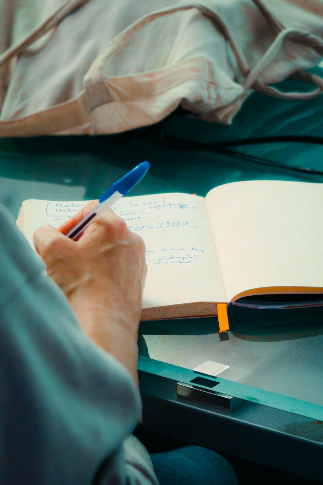 man writing notes