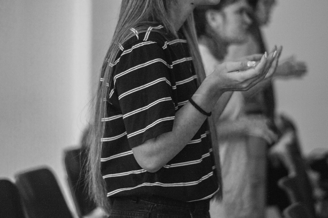 Facilitator speaking to a small group during a personal development session